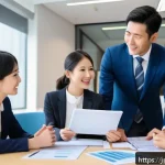중소기업 단체보험 - A modern Japanese office setting with diverse employees of various ages and family backgrounds discu...
